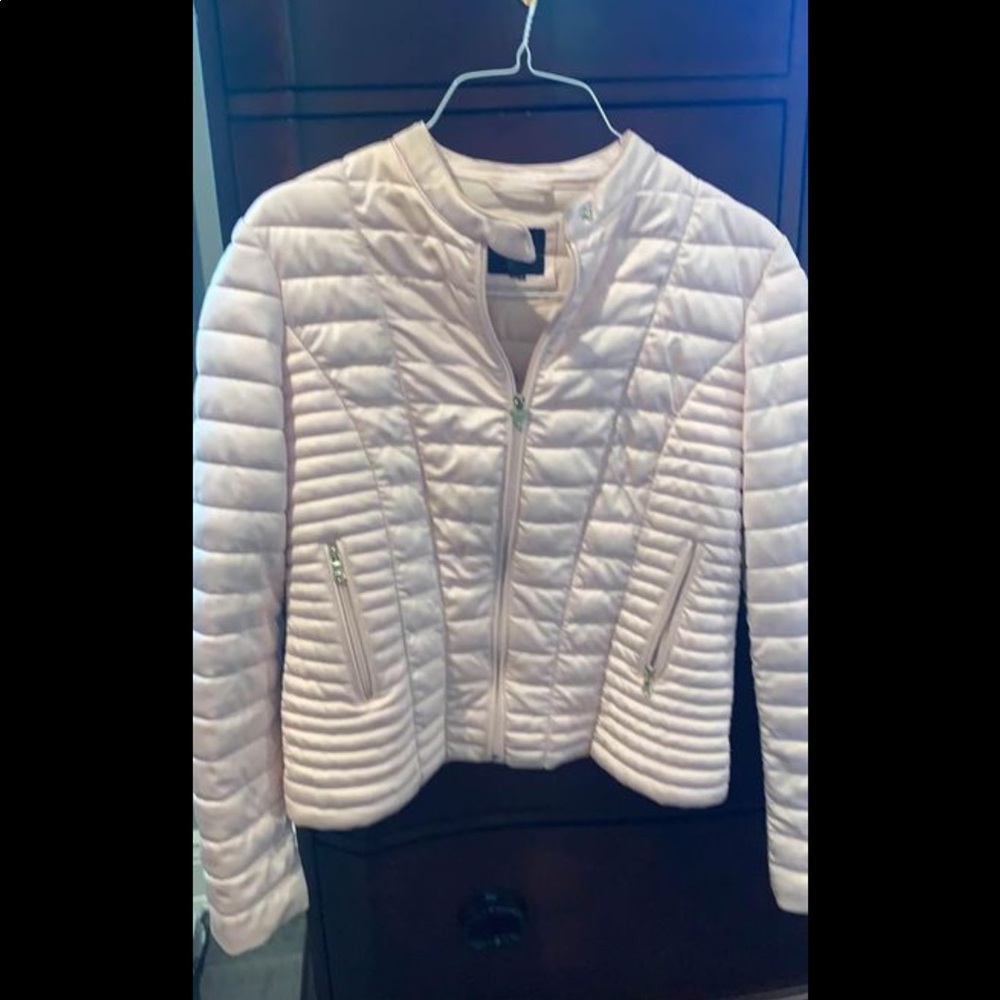Woman’s pale pink light weight jacket.